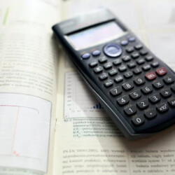 Calculator on a math review book