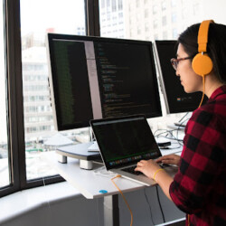 girl coding on a desktop