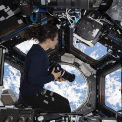 astronauts taking picture from space station
