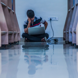 Student studying on a laptop.