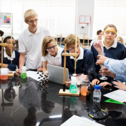 Nstem Students conducting a science experiment in a classroom.