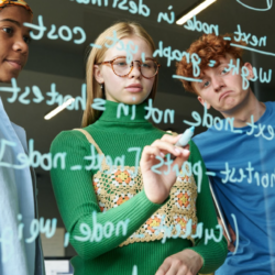 Picture showing two girls and a boy learning something on board