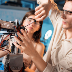 Picture showing male and female working on a project.